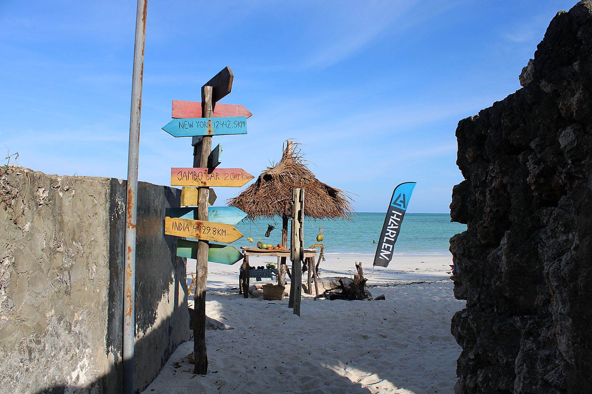 Kitesurfer riding on the turquoise flat lagoon at Paje beach, Zanzibar